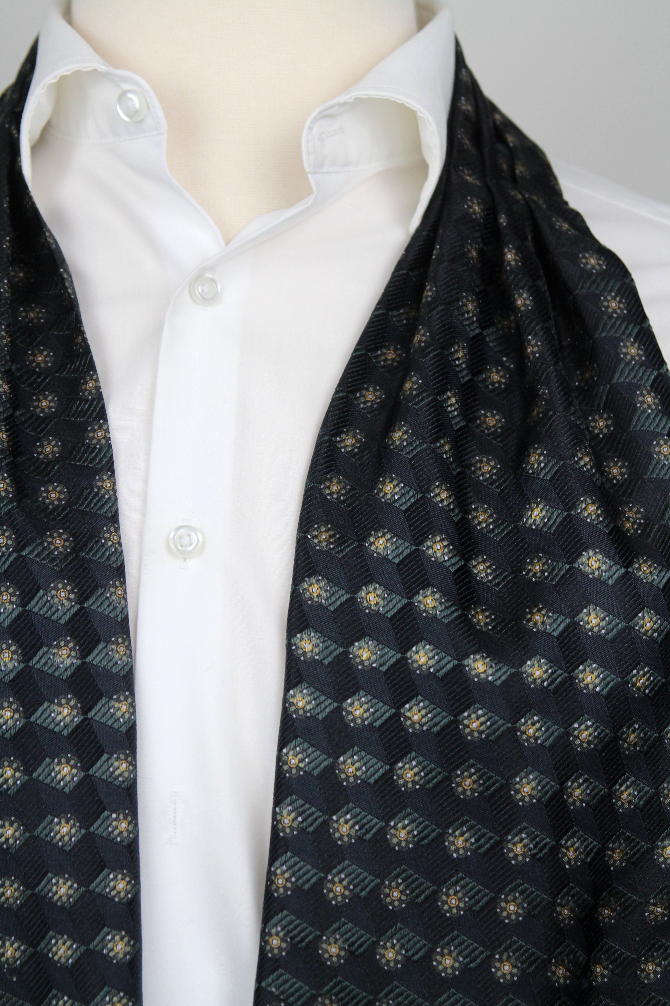 Black Mens Ascot draped over a white shirt on a mannequin