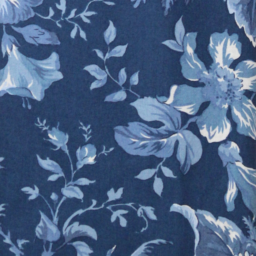Floral pattern with blue flowers and leaves on a dark blue background