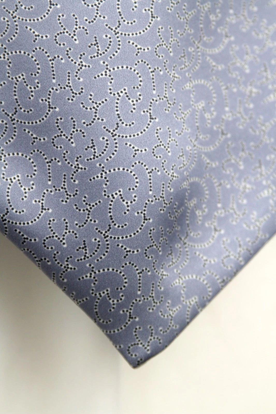 Patterned fabric with a subtle design on a light background