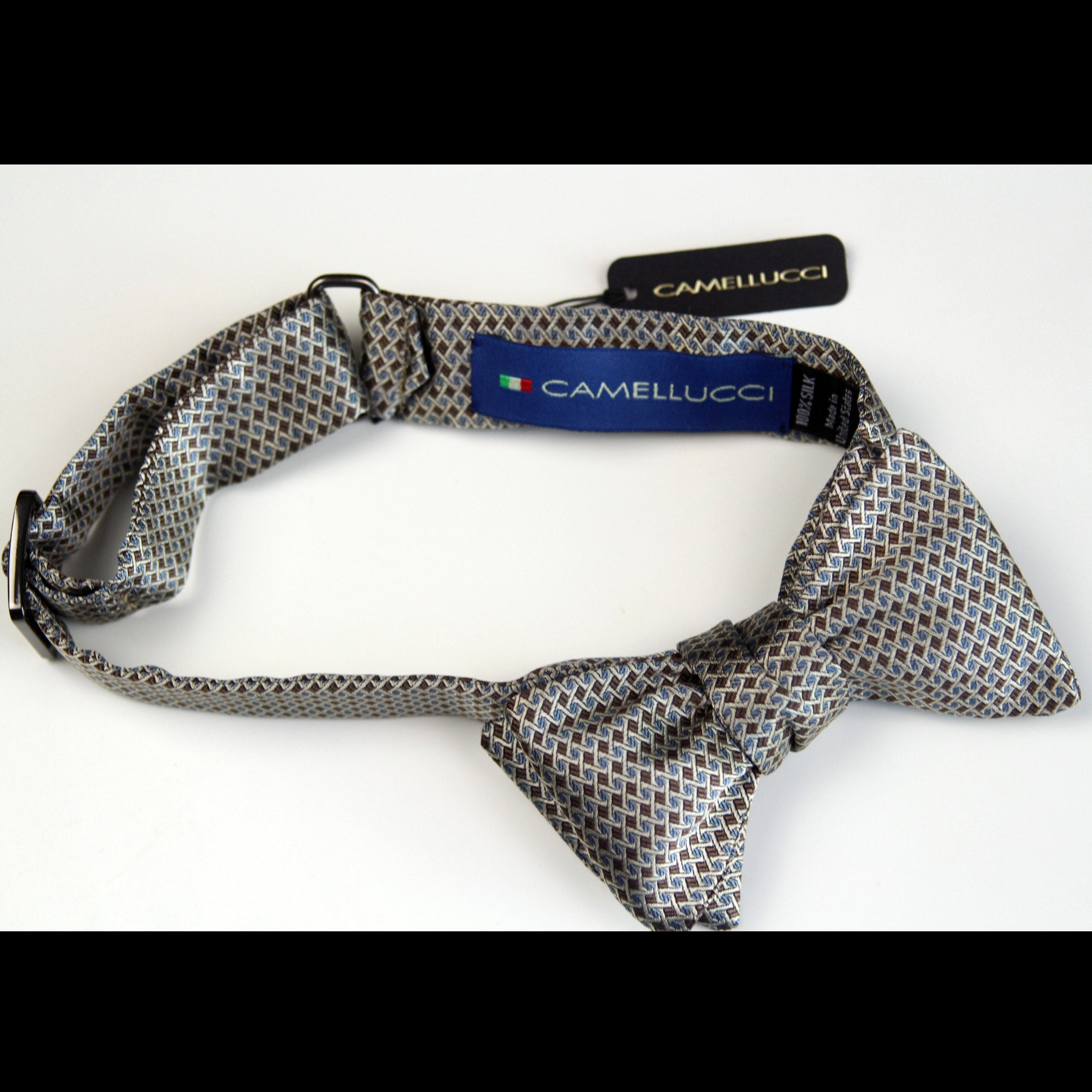 Patterned bow tie with Camellucci label on a white background