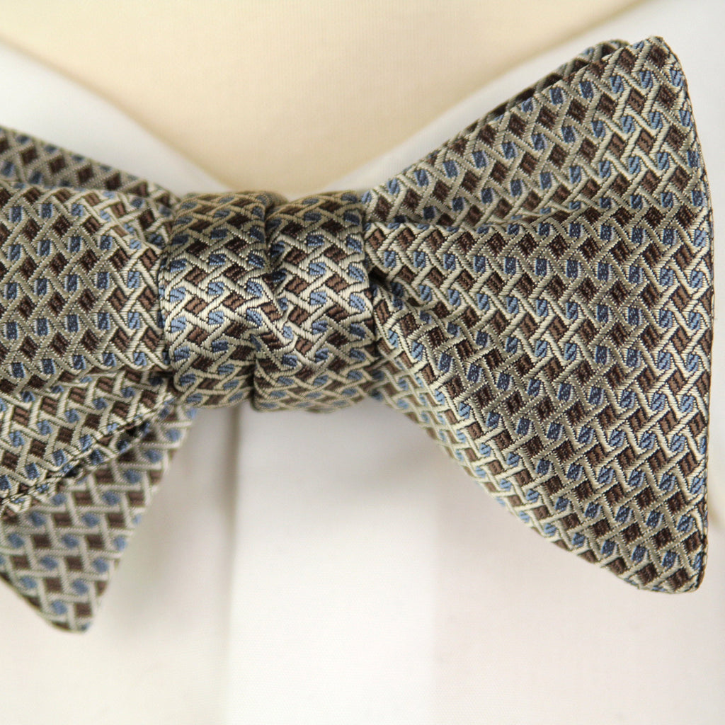Patterned bow tie on a mannequin with a white shirt
