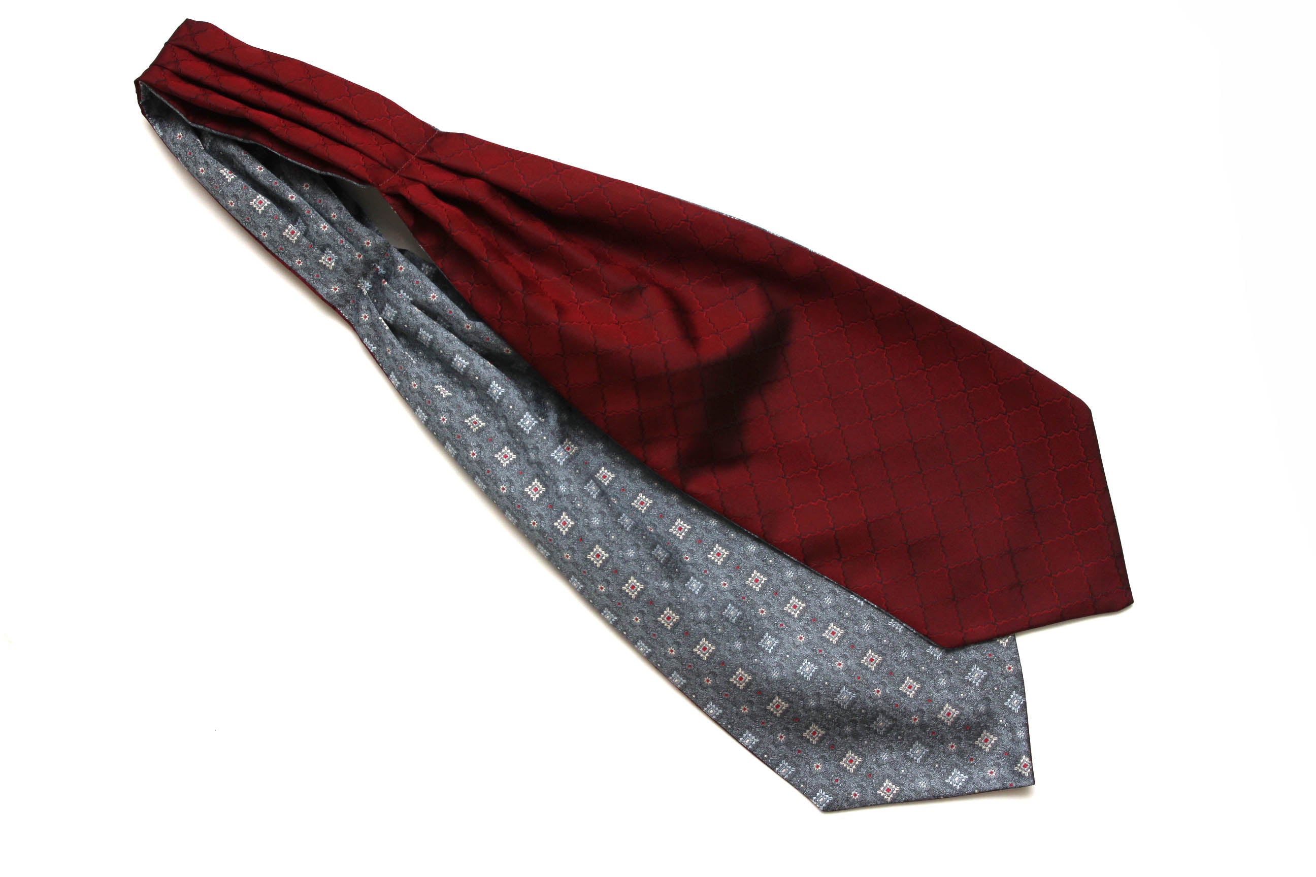 Maroon cravat with patterned lining on a white background